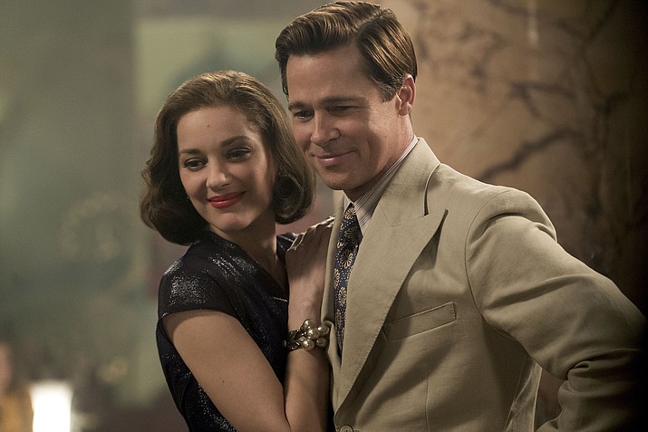 In this image released by Paramount Pictures, Marion Cotillard, left, and Brad Pitt appear in a scene from "Allied."  (Daniel Smith/Paramount Pictures via AP)