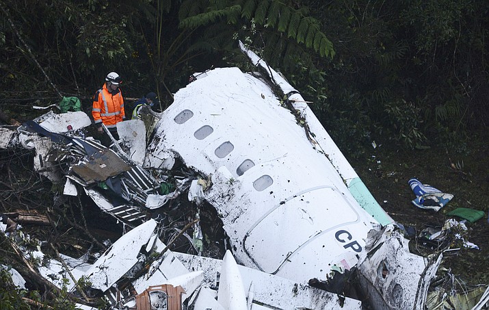 Rescue workers search at the wreckage site of a chartered airplane that crashed outside Medellin, Colombia, Tuesday, Nov. 29. The plane was carrying the Brazilian first division soccer club Chapecoense team that was on it's way for a Copa Sudamericana final match against Colombia's Atletico Nacional.