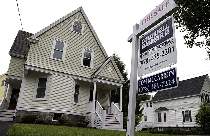 FILE - This Tuesday, May 24, 2016, file photo shows a home for sale in Andover, Mass. On Tuesday, Nov. 22, 2016, the National Association of Realtors reports on October sales of existing homes. (AP Photo/Elise Amendola, File)