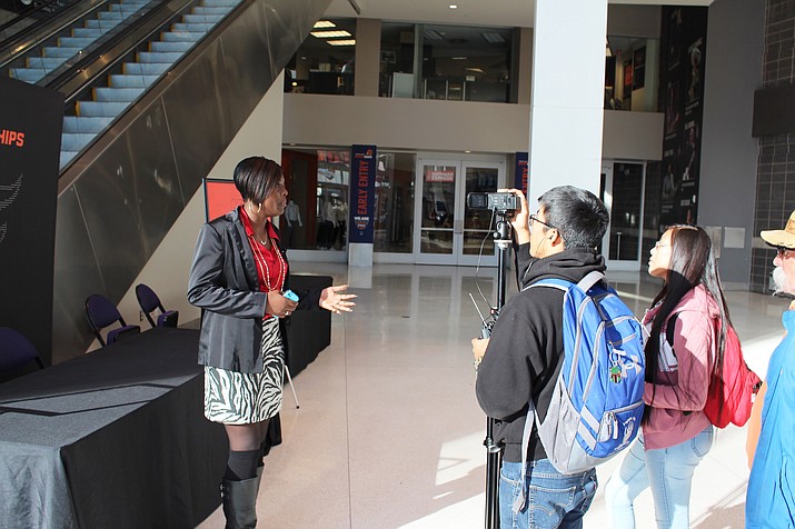 Hopi High School media student Breana Saufkie interviews Phoenix Suns account executive Brianna Eason. Kyle Secakuku shoots the video interview. Stan Bindell/NHO