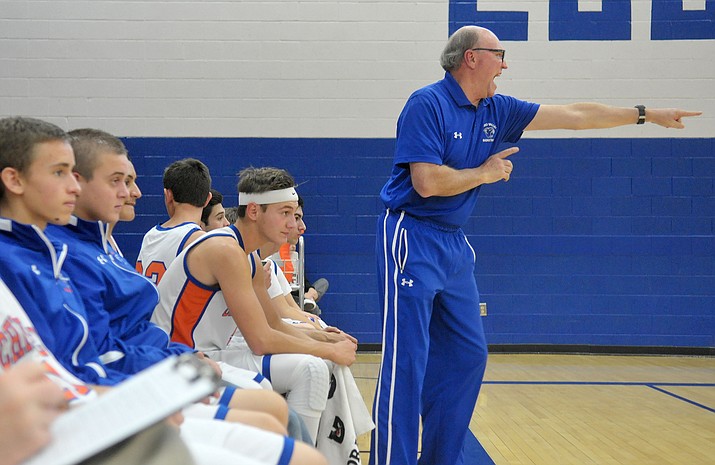 Chino Valley head boys basketball Coach Mike Fogel directs his team during a game last season. The Cougars are 3-1 so far this year. 