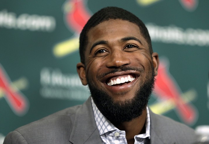 Dexter Fowler smiles during an introductory news conference announcing the free agent center fielder has signed with the St. Louis Cardinals Friday, Dec. 9, 2016, in St. Louis. 