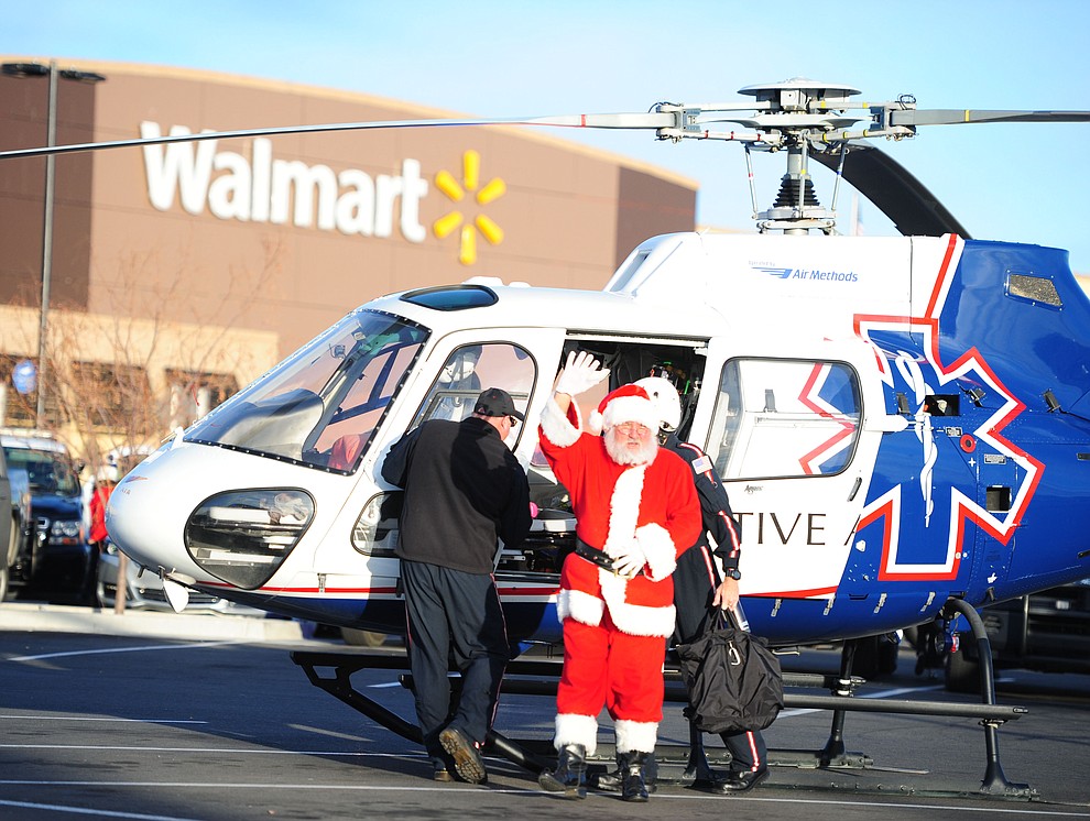 Santa Claus arrives as law enforcement officers from 11 area agencies treated 91 children to a $250. shopping spree as part of the 19th Annual Shop with a Cop at the Prescott Valley Walmart Saturday, December 10.  (Les Stukenberg/The Daily Courier)