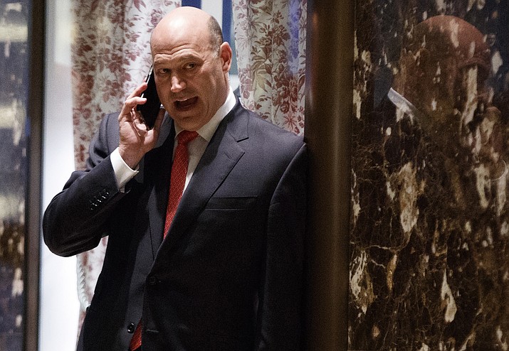 Goldman Sachs COO Gary Cohn talks on the phone as he waits for the start of a meeting with President-elect Donald Trump at Trump Tower, Tuesday, Nov. 29, in New York. 