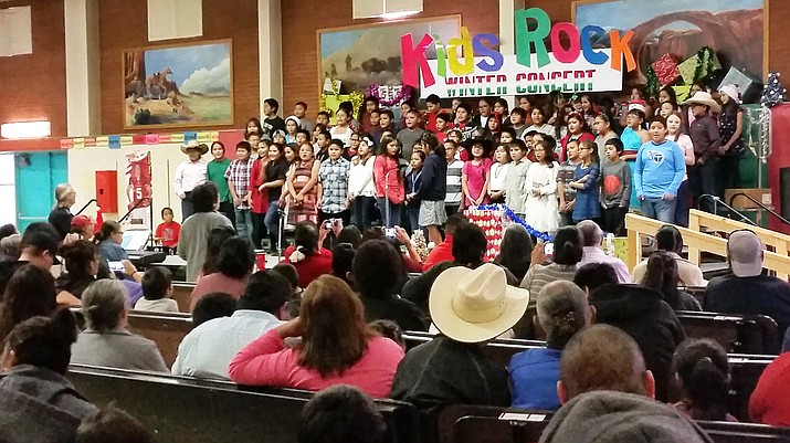 Under the direction of Tuba City Primary music teacher Stephen Almquist, students give a public presentation of holiday songs and songs in the Navajo language. Instruments were also played during part of the Kid's Rock winter concert. Photo/Rosanda Suetopka