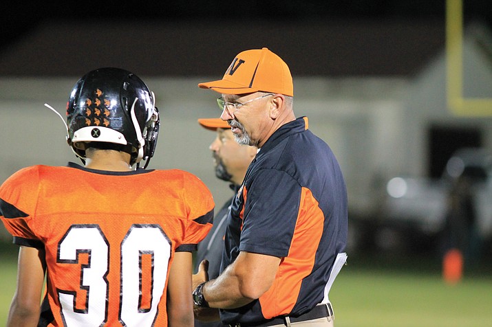 Jeff Brownlee speaks with a player during an earlier season game. Brownlee was selected 1A North Coach of the Year.