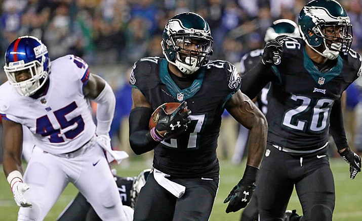 Philadelphia Eagles' Malcolm Jenkins (27) runs for a touchdown after intercepting a pass during the first half of an NFL football game against the New York Giants, Thursday, Dec. 22, in Philadelphia.