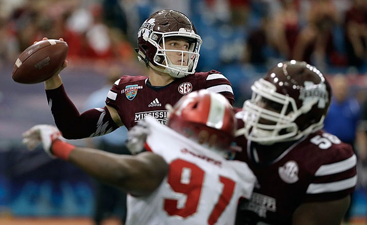 Mississippi State quarterback Nick Fitzgerald throws a pass against Miami (Ohio) during the first half of the St. Petersburg Bowl NCAA college football game Monday, Dec. 26, in St. Petersburg, Fla.
