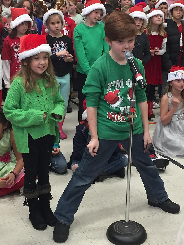 Lincoln Elementary School students sing at their annual holiday concert.