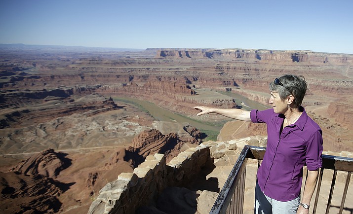 This July 14, 2016, file photo, U.S. Interior Secretary Sally Jewell looks from Dead Horse Point, near Moab, Utah, during a tour to meet with proponents and opponents to the "Bears Ears" monument proposal. President Barack Obama designated two national monuments Wednesday, Dec. 28, at sites in Utah and Nevada that have become key flashpoints over use of public land in the U.S. West.