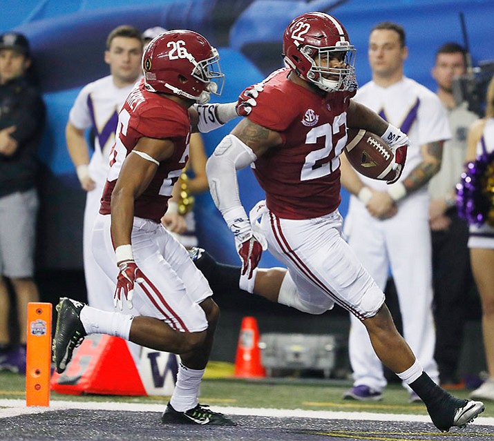 Alabama linebacker Ryan Anderson (22) runs into the end zone for a touchdown with Alabama defensive back Marlon Humphrey (26) against Washington after an interception during the first half of the Peach Bowl NCAA college football playoff game, Saturday, Dec. 31, in Atlanta.