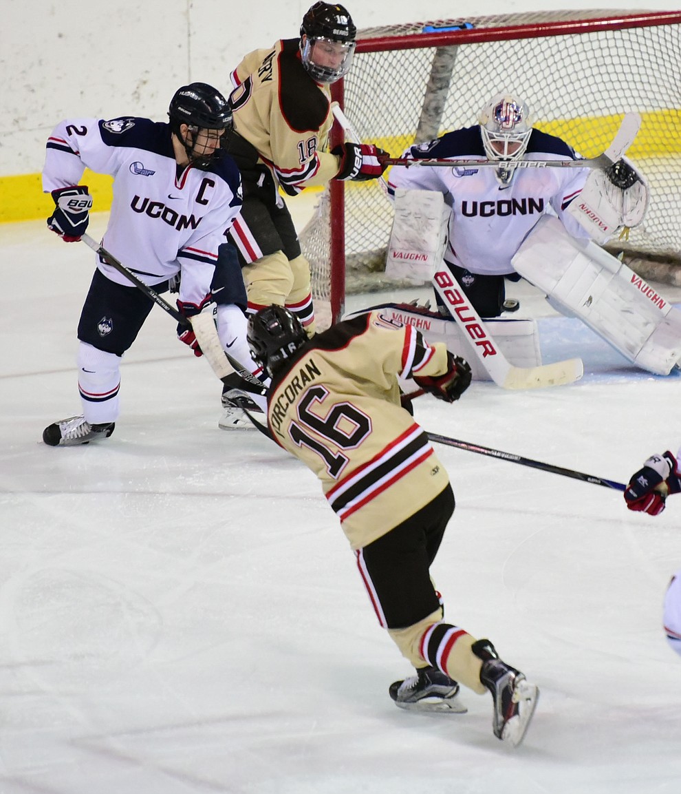 Brown's Charlie Corcoran takes a shot on UConn's goalie Rob Nichols as the Bears from Brown University take on the UConn Huskies in the championship match of the Desert Hockey Classic at the Prescott Valley Event Center Saturday, December 31. (Les Stukenberg/The Daily Courier)