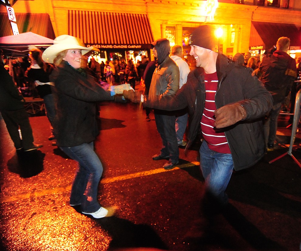 Dancing on the street at the 6th Annual Whiskey Row Boot Drop in downtown Prescott Saturday, Dec. 31. (Les Stukenberg/The Daily Courier)