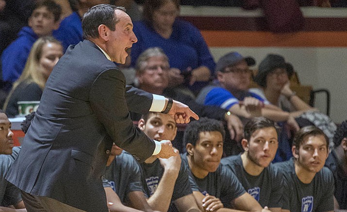Duke head coach Mike Krzyzewski yells to his players during the first half of an NCAA college basketball game Saturday, Dec. 31, at Cassell Coliseum in Blacksburg, Va. Tech won 89-75.