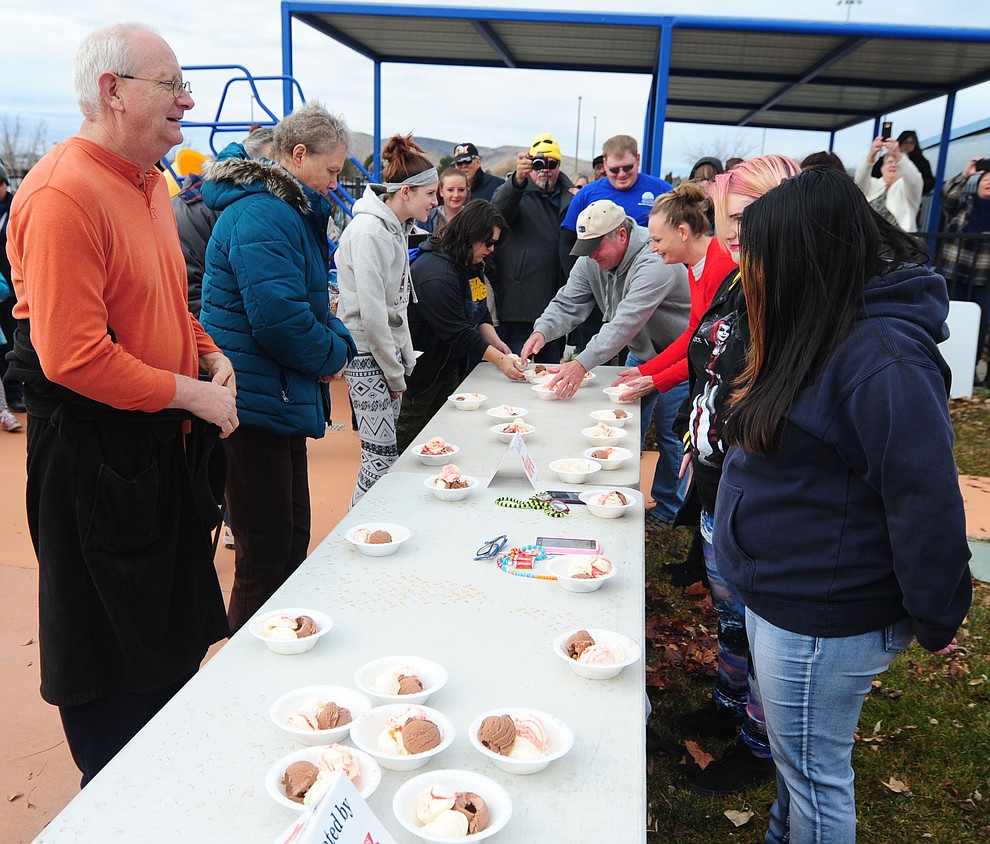 Adults lineup for the ice cream eating contest during the 11th Annual Polar Bear Plunge at Mountain Valley Splash in Prescott Valley Saturday, January 7. (Les Stukenberg/The Daily Courier)