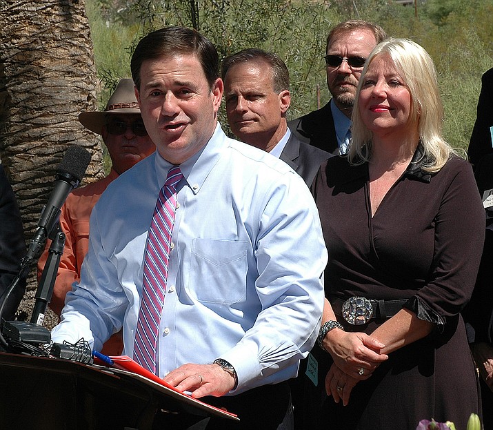Gov. Doug Ducey and Sen. Debbie Lesko earlier this year at ceremonial signing of legislation preempting most local regulation of home sharing services.