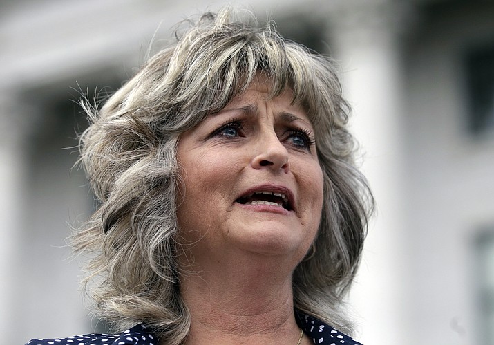 This Saturday, March 5, 2016, file photo, Jeanette Finicum speaks with reporters during a rally at the Utah State Capitol, in Salt Lake City.  Finicum, the widow of an Arizona rancher LaVoy Finicum killed by FBI agents in a Jan. 26, 2016,  traffic stop in central Oregon,  is  planning to hold a meeting in John Day, Ore., Jan. 28, 2017, with their children,  in an effort to continue with his mission.                                                                                                        