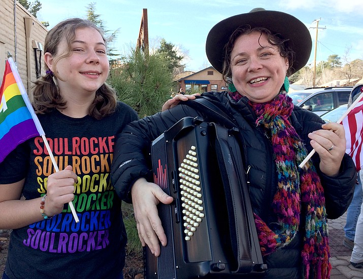 Two of three generations planning to attend the Women’s March on Washington in Washington, D.C., also took part in Prescott’s Martin Luther King Jr. March on Jan. 16. Meg Bohrman, right, provided music and freedom songs, with daughter, Opal, 14. 
