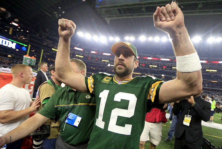 Green Bay Packers quarterback Aaron Rodgers (12) celebrates after winning an NFL divisional playoff football game against the Dallas Cowboys Sunday, Jan. 15, 2017, in Arlington, Texas. The Packers won 34-31. (Ron Jenkins/Associated Press)