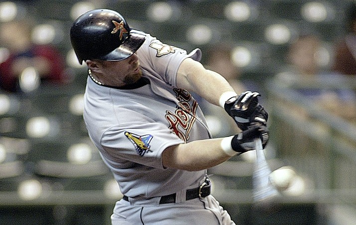 In this April 20, 2003, file photo, Houston Astros’ Jeff Bagwell hits a home run against the Milwaukee Brewers in the fifth inning of a baseball game in Milwaukee. (Darren Hauck/Associated Press, File)