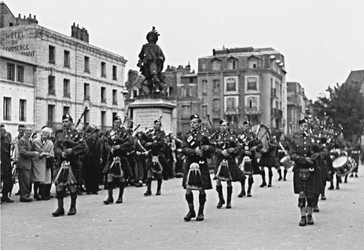 The Essex Scottish and its pipe band enter Dieppe, France, with the forward-sweeping Canadian Army. The Dieppe raid saw the Essex Scottish take over 500 men to France and only 51 made it out to return back to England.

