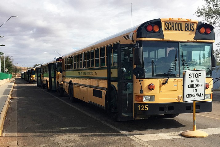 Tuba City Unified School District buses line up at the Tuba City Primary School to drop students off at the end of a school day. The bus line covers Red Lake, Tuba City, Gap-Bodaway, Cameron, Moencopi villages, Hardrock, the Coalmine chapter, and the eastern-most Hopi villages. Photo/Rosanda Suetopka