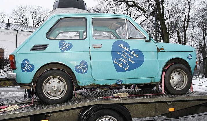 In this photo taken Jan. 21, 2017 in Suwalki, Poland a Fiat 126p that fans have bought for actor Tom Hanks as a souvenir, sits on a trailer. Fans bought the car after they saw photos he posted of himself jokingly posing with such tiny cars parked in the streets of Budapest, Hungary. The cars were made in Bielsko-Biala, Poland from 1973-2000. A fan in Bielsko-Biala, Monika Jaskolska, organized a public collection for the car which, after an overhaul and a paint job is to be flown to Los Angeles.