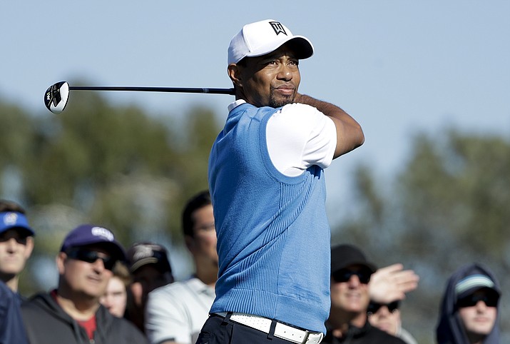 Tiger Woods watches his tee shot on the second hole of the south course during the first round of the Farmers Insurance Open golf tournament Thursday, Jan. 26, in San Diego. (Gregory Bull/Associated Press)
