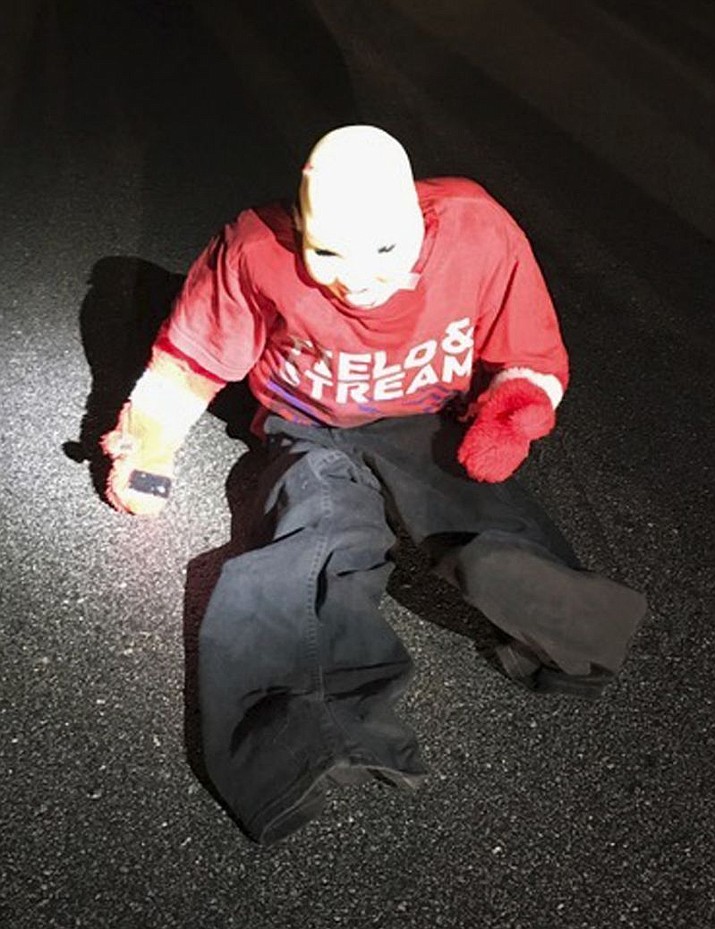 This Sunday, Jan. 22, 2017 photo provided by Carteret County Sheriff’s Office in North Carolina shows a dummy constructed of a fake plastic head and children’s clothing that was left in the road in the county’s Paradise East subdivision. A sheriff’s statement said a woman narrowly escaped being carjacked by multiple men who pulled on her door handles after she slowed down for the dummy that she thought was a child in the road.