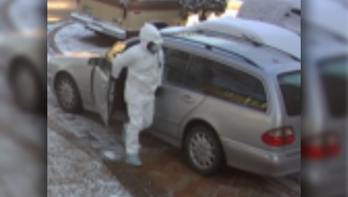Police say this man exited his vehicle dressed in a biohazard suit, entered a home through an unlocked back door and made off with a safe containing $200,000.