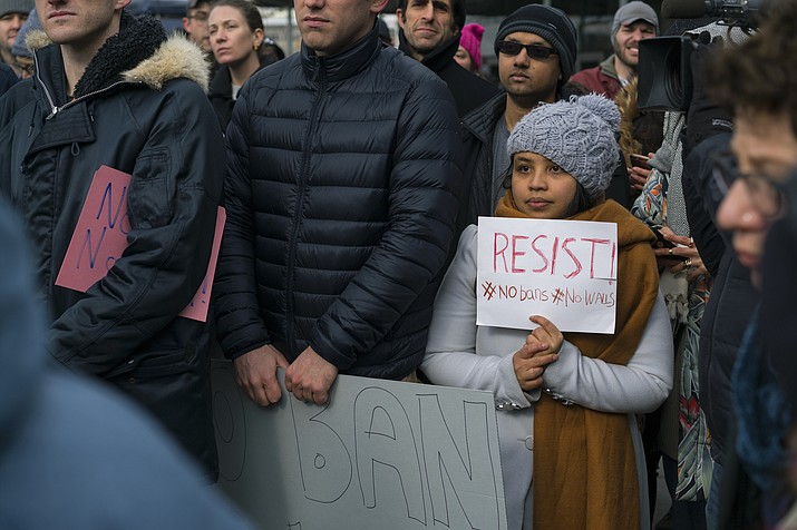 Protesters assemble at John F. Kennedy International Airport in New York, Saturday, Jan. 28, 2017 after two Iraqi refugees were detained while trying to enter the country. On Friday, Jan. 27, President Donald Trump signed an executive order suspending all immigration from countries with terrorism concerns for 90 days. Countries included in the ban are Iraq, Syria, Iran, Sudan, Libya, Somalia and Yemen, which are all Muslim-majority nations. (AP Photo/Craig Ruttle)