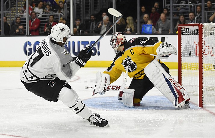 Metropolitan Division forward Wayne Simmonds, of the Philadelphia Flyers, scores on Atlantic Division goalie Carey Price, of the Montreal Canadiens, during Sunday’s NHL All-Star hockey game in Los Angeles.
