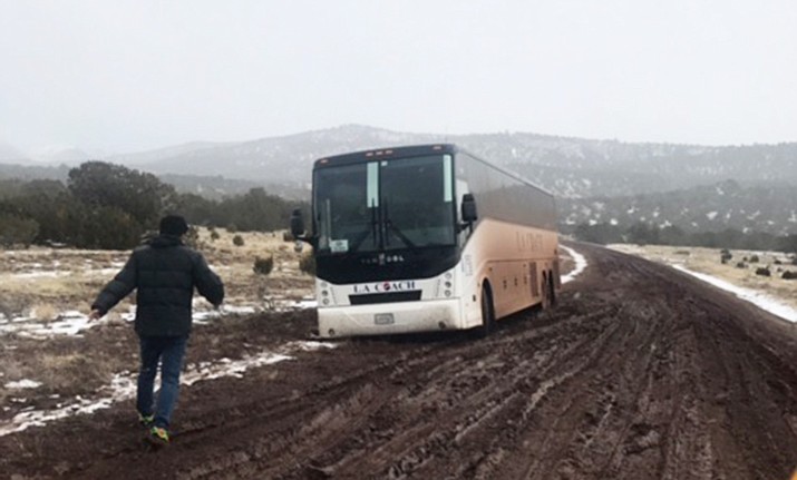 A tour bus carrying 44 tourists became stuck in the mud near Valle just prior to a Jan. 23 snowstorm.