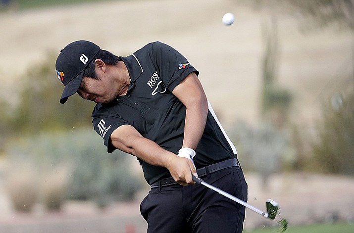 Byeong Hun An, of Korea, hits from the 15th fairway during the second round of the Phoenix Open on Friday in Scottsdale. (Matt York/Associated Press)