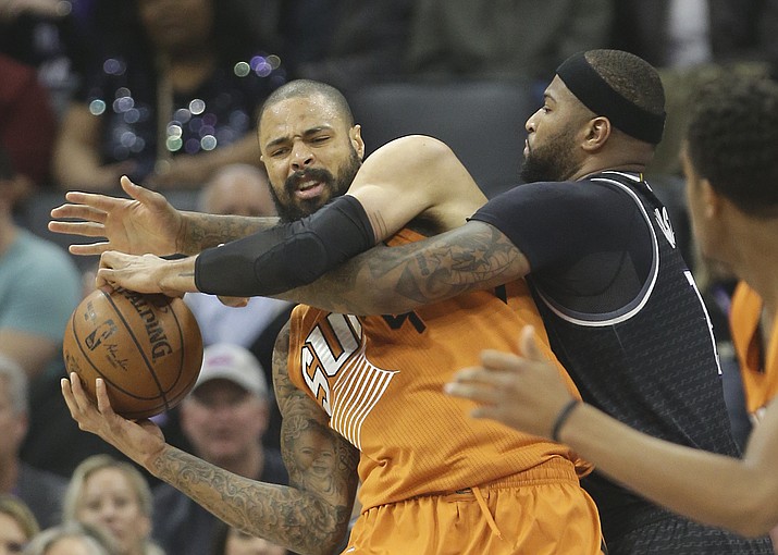 Phoenix Suns center Tyson Chandler, left, pulls a rebound away from Sacramento Kings forward DeMarcus Cousins during the first quarter Friday, Feb. 3, in Sacramento, Calif. (Rich Pedroncelli/Associated Press)