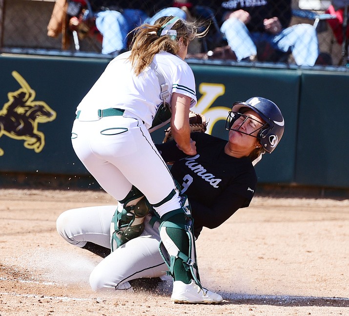 Yavapai’s Savanna Ramirez tags out Alexis Gonzalez on Tuesday as the Roughriders take on Paradise Valley Community College in Prescott. (Les Stukenberg/The Daily Courier)