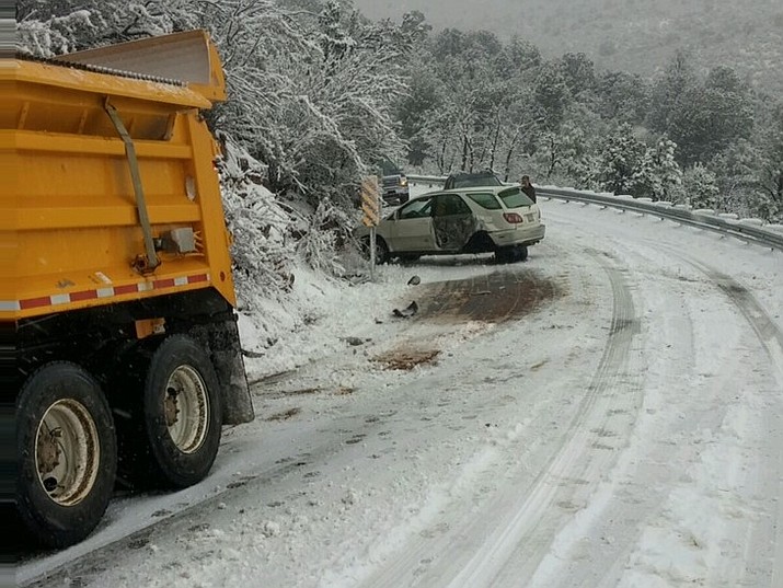 An SUV suffered serious damage Jan. 19 when it hit a snowplow clearing SR 89A between Prescott Valley and Jerome. (Arizona Department of Transportation)