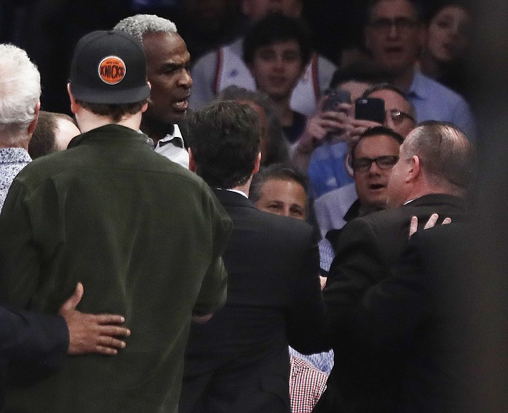 Former New York Knicks player Charles Oakley exchanges words with a security guard during the first half of an NBA basketball game between the New York Knicks and the LA Clippers, Wednesday, Feb. 8, in New York.
