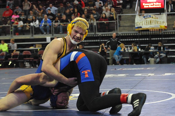 Jon Dwyer looks over at the scorers table towards the end of his D-III state championship match with Thunderbird’s Eric Mickelson on Friday, Feb. 11, at the Prescott Valley Event Center. Dwyer won by an 8-6 decision to claim the D-III state title. (Doug Cook/The Daily Courier)