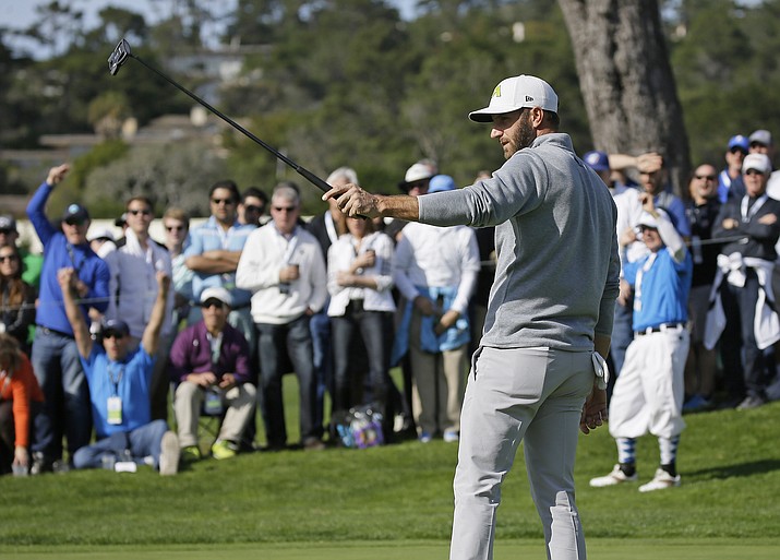 Dustin Johnson reacts after making a birdie putt on the 16th green of the Pebble Beach Golf Links during the final round of the AT&T Pebble Beach National Pro-Am golf tournament Sunday, Feb. 12, in Pebble Beach, Calif. Johnson finished in third place at total 14-under-par.