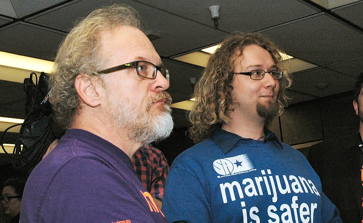 David Wisniewski and Alex Gentry, organizers of a petition drive to legalize marijuana, chat with reporters Thursday after filing the paperwork to start gathering signatures to put the measure on the 2018 ballot. (Capitol Media Services photo by Howard Fischer)
