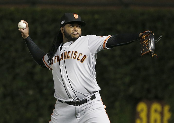 San Francisco Giants starting pitcher Johnny Cueto warms up before Game 1 of the National League Division Series against the Chicago Cubs on Oct. 7, 2016, in Chicago. (Nam Y. Huh/Associated Press, File)
