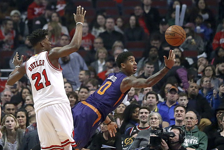 Phoenix Suns' Marquese Chriss (0) takes a shot after being fouled by Chicago Bulls' Jimmy Butler during the first half of an NBA basketball game Friday, Feb. 24, in Chicago. (Charles Rex Arbogast/Associated Press)