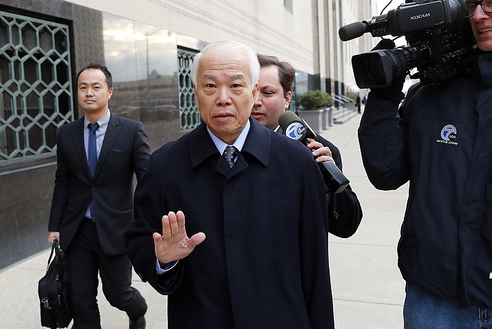 Takata Corp.'s chief financial officer Yoichiro Nomura leaves federal court in Detroit, Monday. Japanese auto parts maker Takata Corp. pleaded guilty to fraud and agreed to pay $1 billion in penalties for concealing an air bag defect blamed for at least 16 deaths, most of them in the U.S.