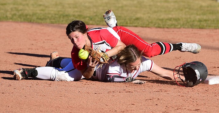Bradshaw Mountain's Shelbi Audsley dives safely back into second base as the Lady Bears take on Coconino in Prescott Valley Thursday, March 2. (Les Stukenberg/The Daily Courier)