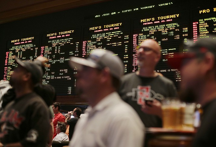 Odds for second round NCAA tournament games are displayed on a board at the Mirage hotel-casino Race & Sports Book on March 22, 2013, in Las Vegas. (Julie Jacobson/AP)