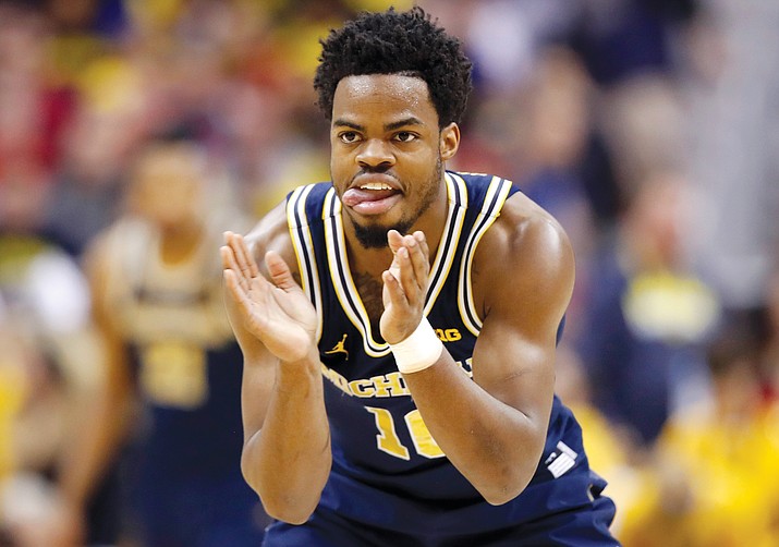 Michigan guard Derrick Walton Jr.  reacts during the first half of the Big Ten NCAA college basketball championship game against Wisconsin, Sunday, March 12. 