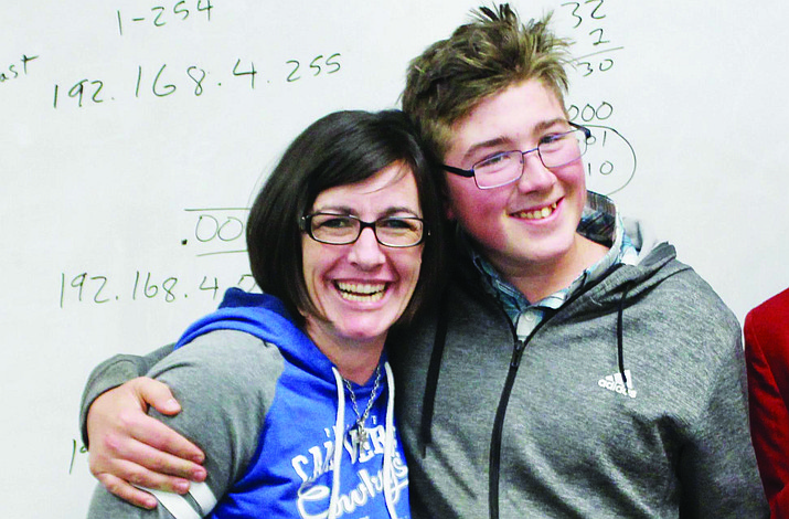 Camp Verde High School graphic arts instructor Tina Scott with junior Dustin Foster, who won the gold medal for Cabinetmaking at the March 3 SkillsUSA Regional competition. (Courtesy photo)