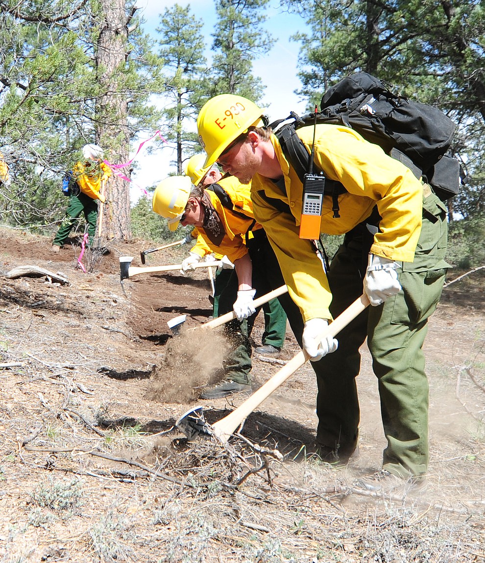 S130/190 Basic Wildland Firefighting students cut line during the Arizona Wildfire Academy field day Wednesday, March 15 near the Iron Spring Road and Skyline Drive area in Prescott. (Les Stukenberg/The Daily Courier)