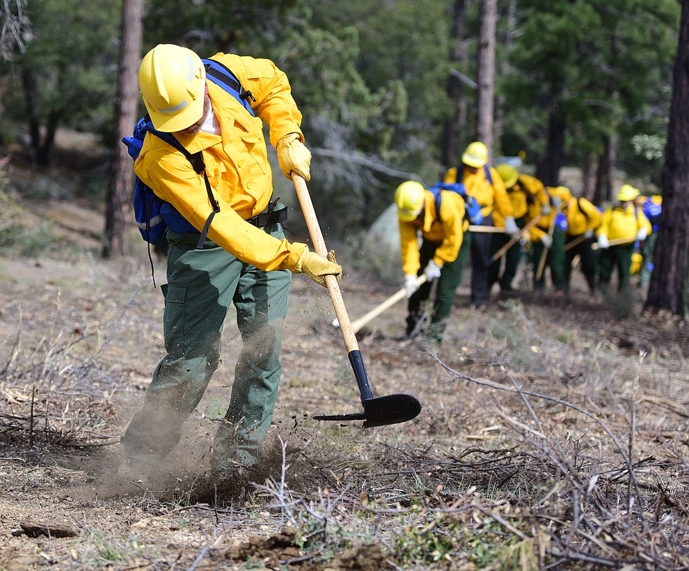 S130/190 Basic Wildland Firefighting students cut line during the Arizona Wildfire Academy field day Wednesday, March 15 near the Iron Spring Road and Skyline Drive area in Prescott. (Les Stukenberg/The Daily Courier)